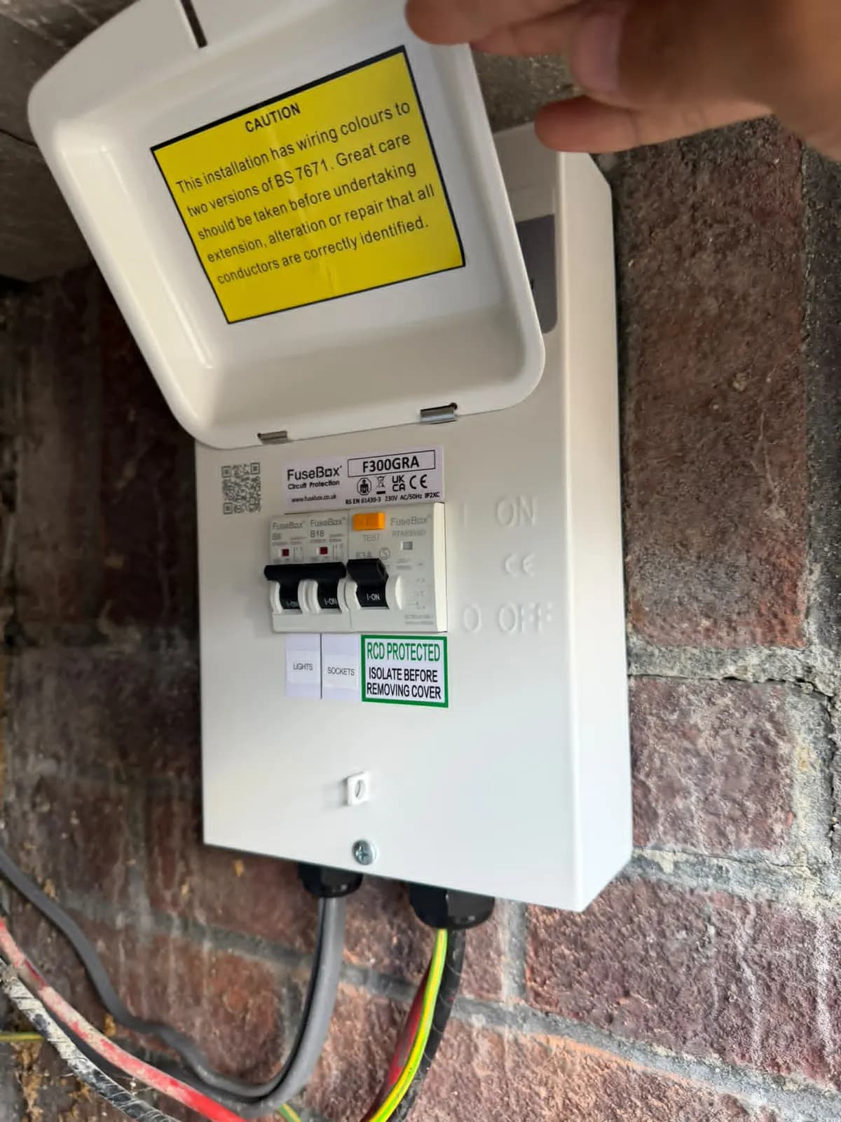 New metal consumer unit with RCD protection fitted in the same Redhill cupboard